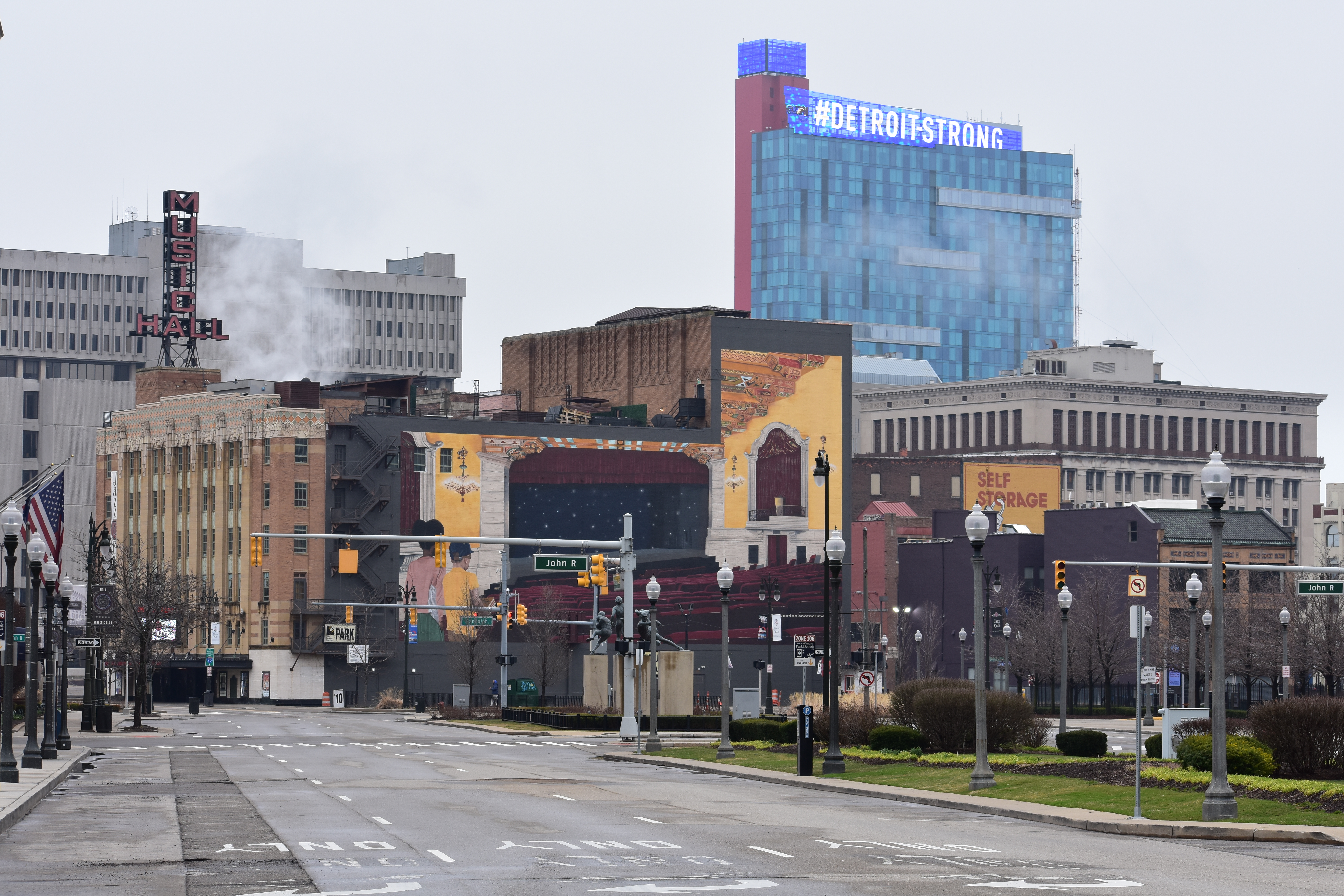 Madison Street and John R Street, with #Detroit-Strong displayed atop the Greektown Casino-Hotel in the background